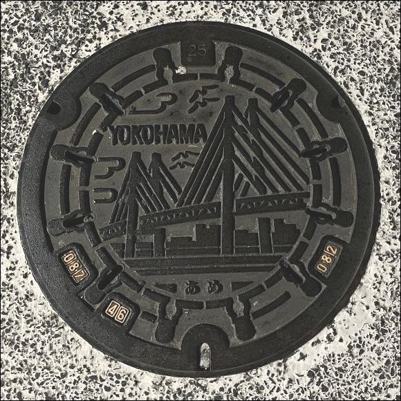 manhole cover - Yokohama municipal design - natural metal