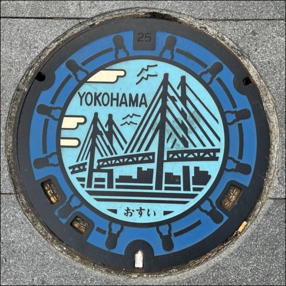 manhole cover - Yokohama municipal design - mainly coloured in shades of blue